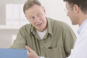 Mature Man being consulted by a Physician